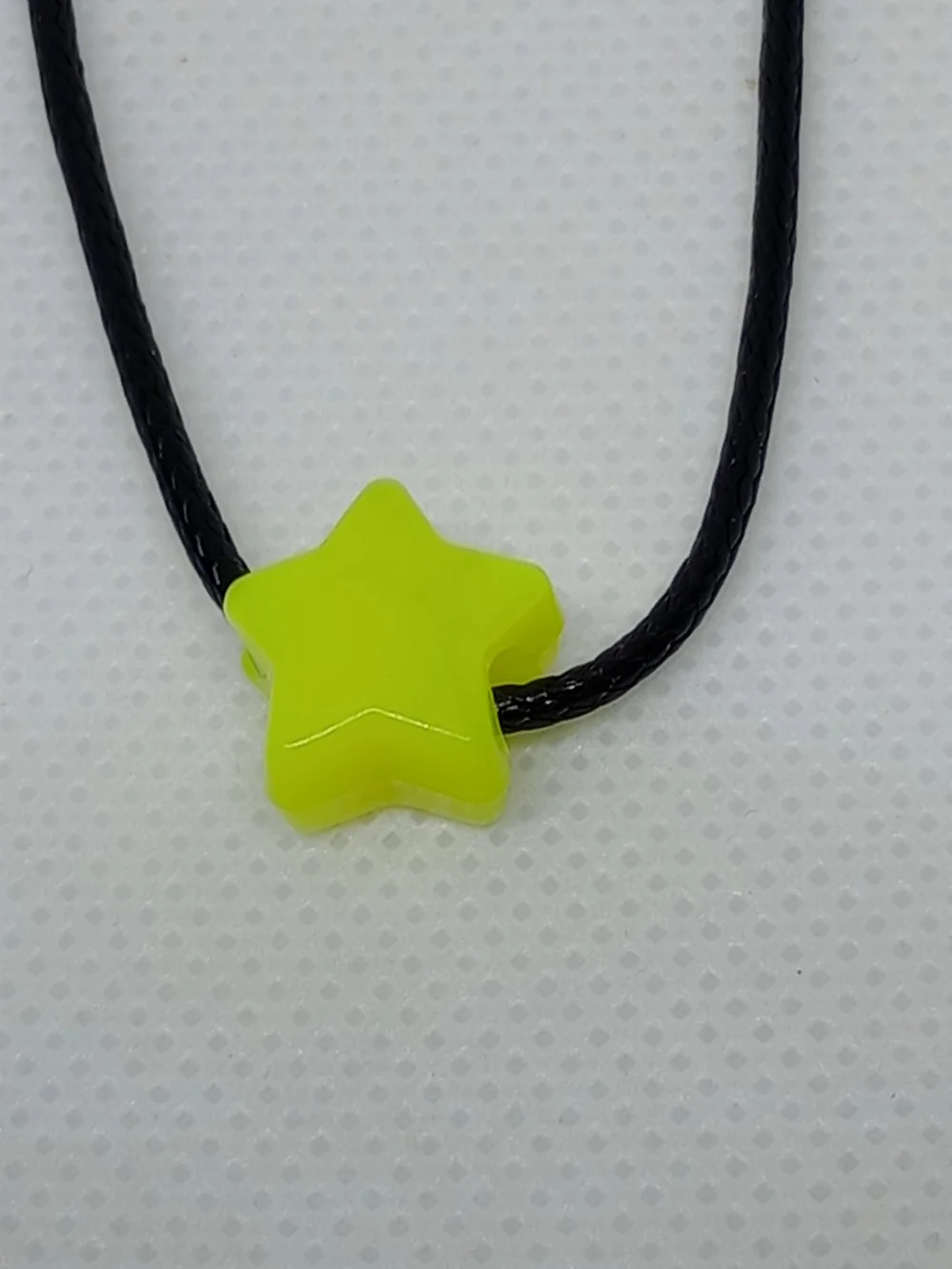 Neon Yellow Star Pendant Necklace on Black Cord